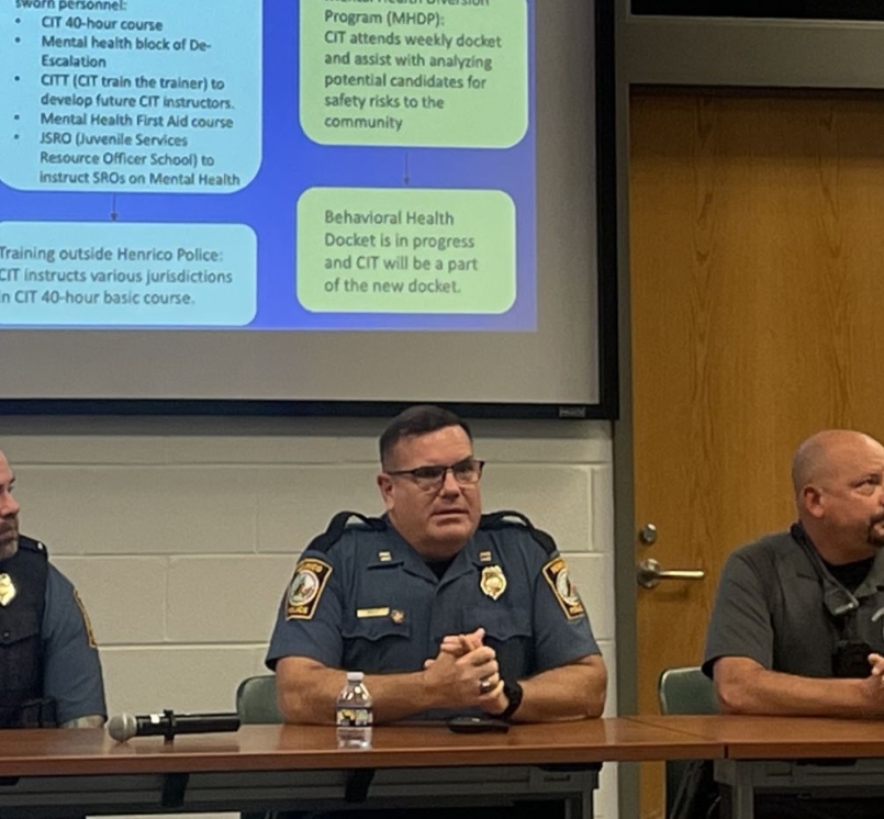 Officers from the Henrico County Police Division’s community services department discuss how they collaborate to help keep mentally ill people from continual jail visits. Photo by Meredith Moran 