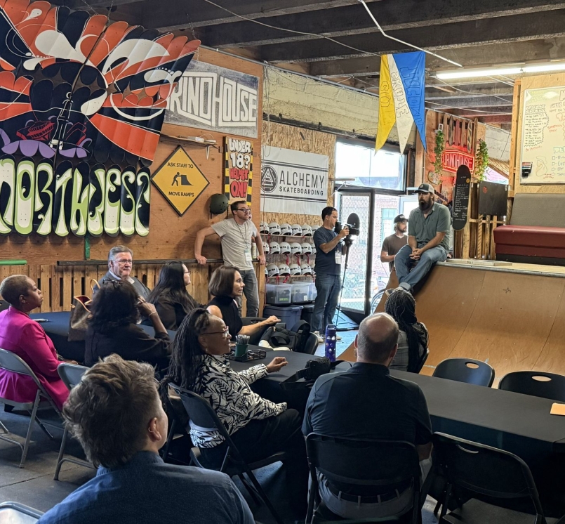Taylor Woodruff, executive director of Youth Serving Agencies Network member organization Alchemy Skateboarding, outlines his organization's community-based programming for court-involved youth centered around skateboarding and manufacturing skills. Photo by Bryce Wilkom