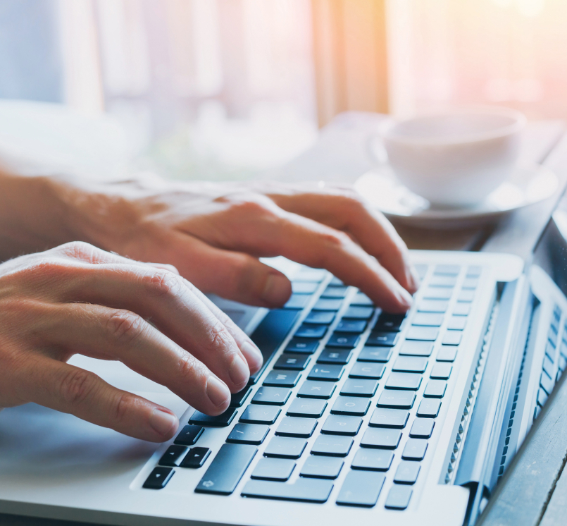 close up of hands of business person working on computer, man using internet and social media