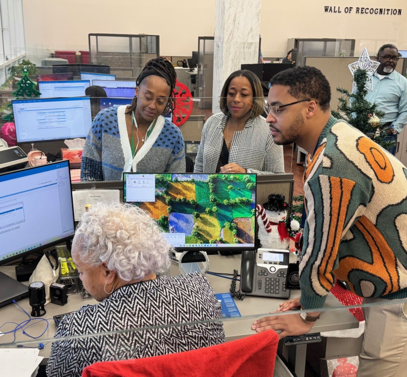 Staff members from different generations collaborate on a project in the Dallas County, Texas clerk's office. Photo courtesy of the Dallas County Clerk's Office