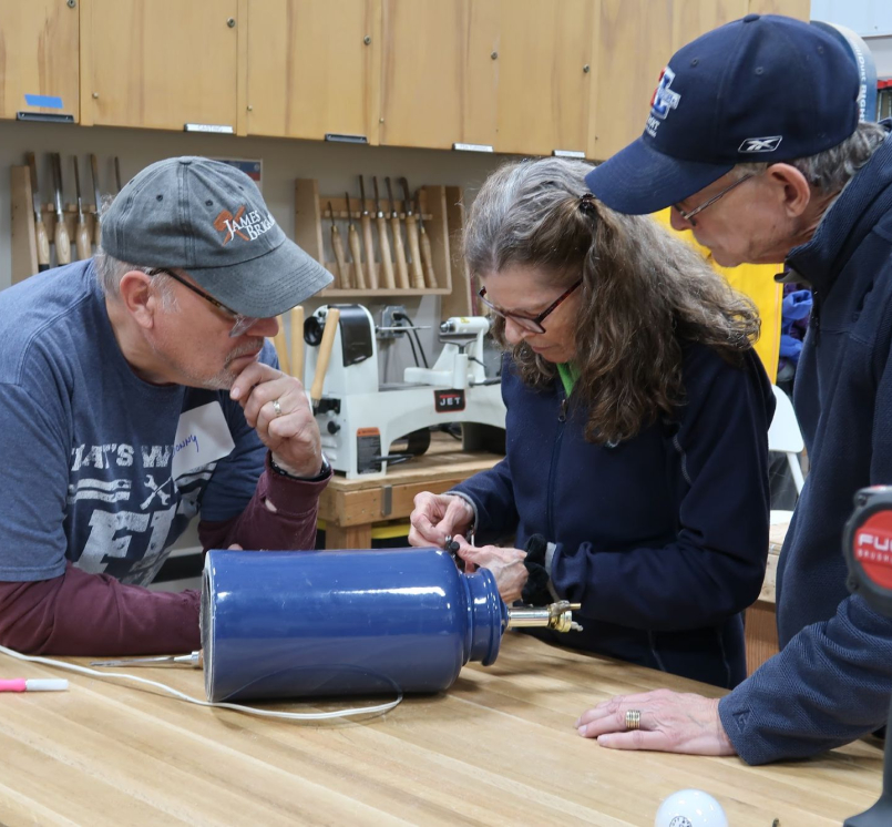 Volunteers work together at a Fix-It Fair. Photo courtesy of Rob Pudner
