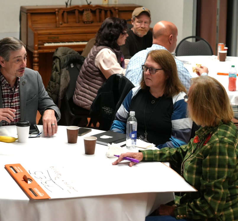 Dickenson County, Va. Supervisor Chris Hall, Story County, Iowa Planning and Development Director Leanne Harter and Crook County, Ore. Commissioner Susan Hermreck discuss parameters for regulation of local energy projects during the December 2025 NACo Rural Energy Academy. Photo by Charlie Ban 