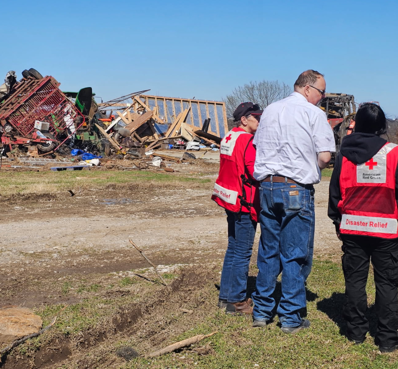 Okmulgee County, Okla. Emergency Manager Jeff Moore surveys tornado damage with Red Cross volunteers. Photo courtesy of the Red Cross