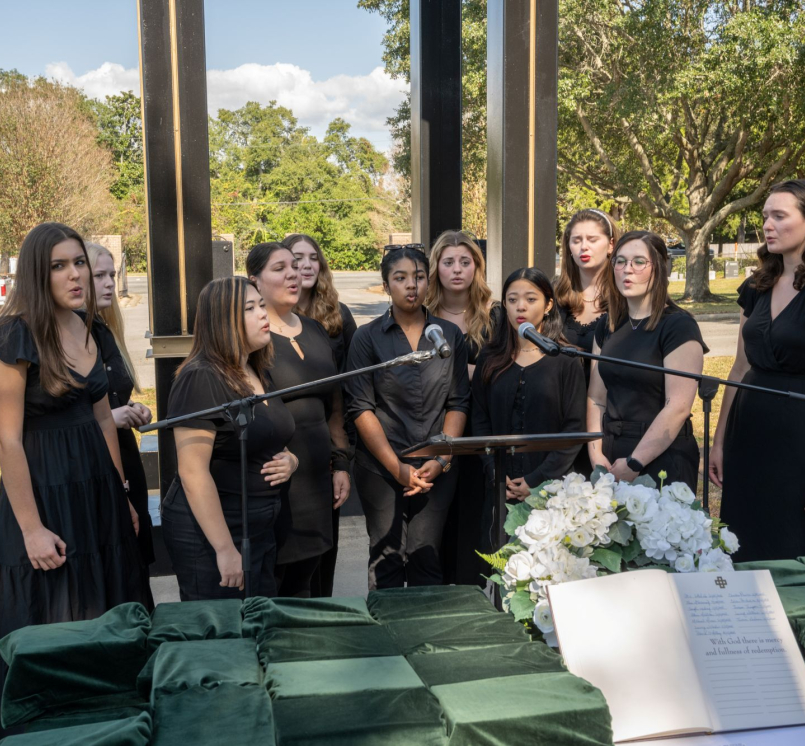 Choir members sing at a ceremony honoring the county's indigent who went unclaimed after their deaths.