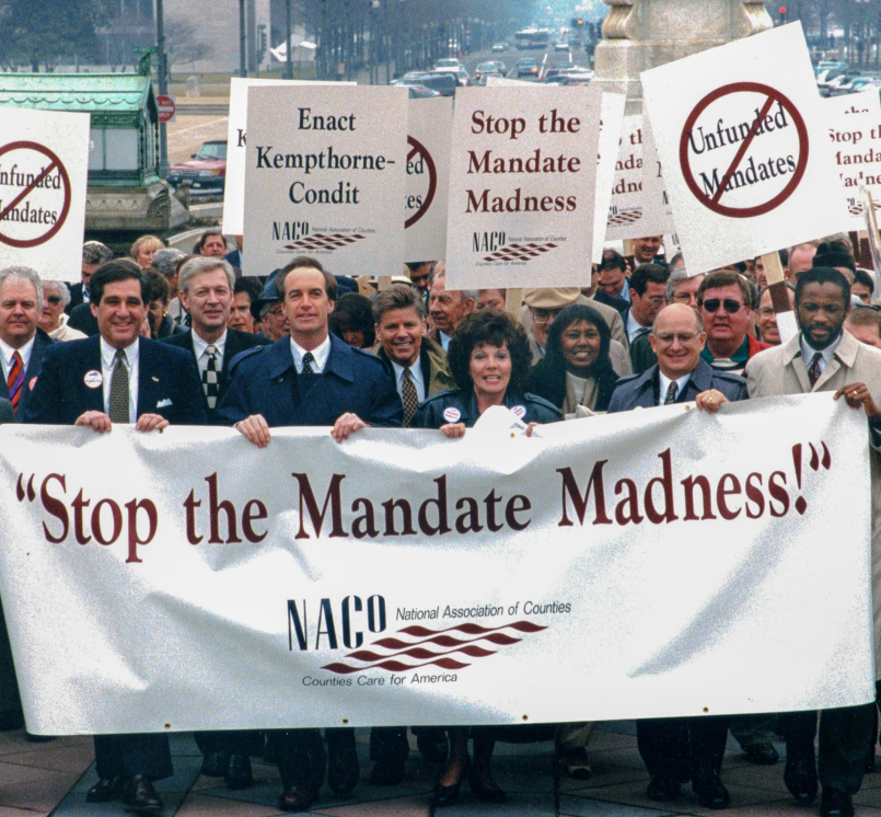 Sen. Dirk Kempthorne (front row, fifth from left) joins a march to the U.S. Capitol during the 1994 NACo Legislation Conference. Photo by David Hathcox