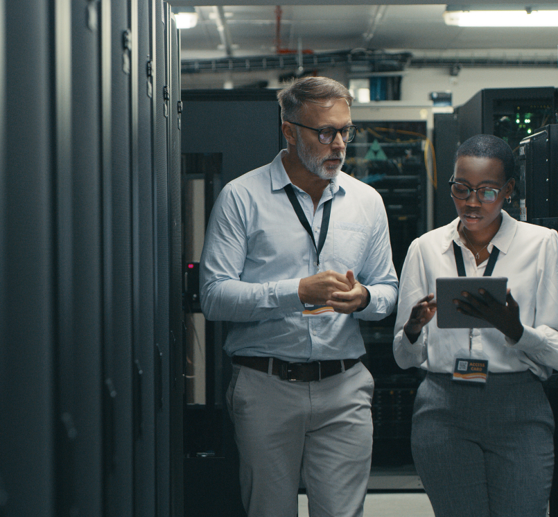Shot of a man and woman using a digital tablet while working in a data center