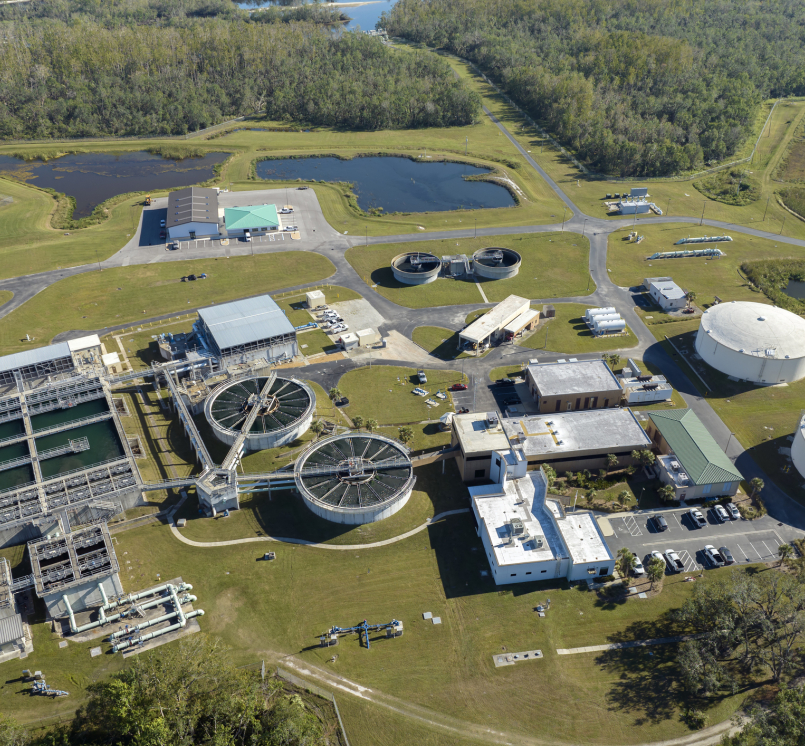 Modern water cleaning facility at urban wastewater treatment plant. Purification process of removing undesirable chemicals, suspended solids and gases from contaminated liquid - Stock Photo