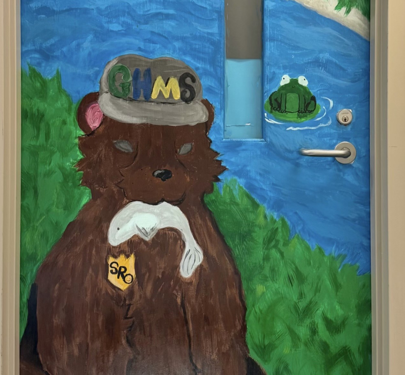 Orange County, N.C.’s Youth Deflection Program connected a youth referred for graffiti with a local arts nonprofit, where the young person received mentorship and found a positive outlet for their artistic talents, including helping paint this mural on a school resource officer’s door.