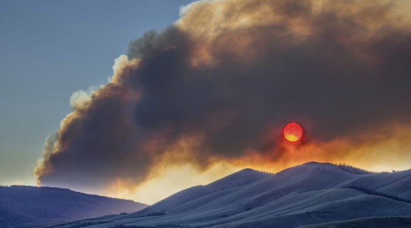 Sunset obscured by wildfire smoke