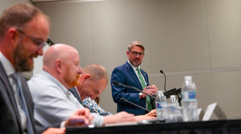 Kevin Leonard, executive director of the North Carolina Association of County Commissioners cracks a joke before state association directors get down to business. Photo by Leon Lawrence III