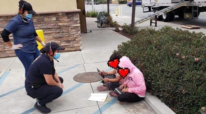Two Monterey County, Calif. students use Wi-Fi from a Taco Bell restaurant in East Salinas to do their schoolwork in August 2020. Photo courtesy of Monterey County