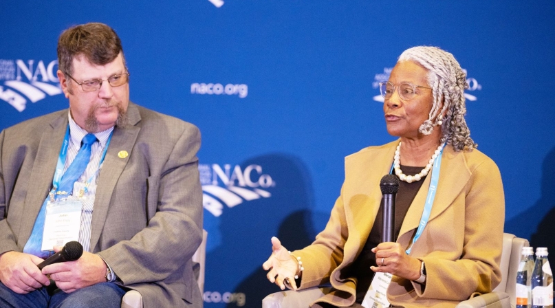 Mobile County, Ala. Commissioner Merceria Ludgood (right) and Carbon County, Wyo. Commissioner John Espy participate in a panel discussion at the ForwardTogether Symposium. Photo by Justin Cox 