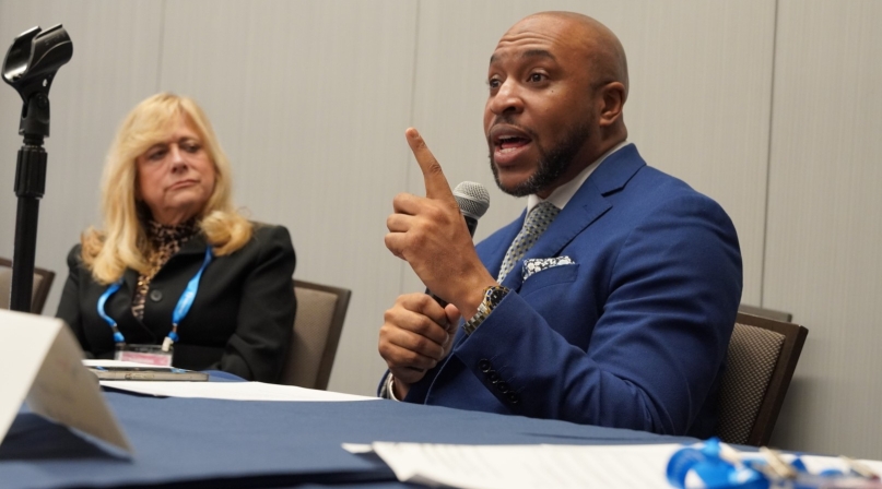 Aaron Myers, executive director, D.C. Commission on the Arts and Humanities, speaks Saturday to members of the NACo Arts & Culture Commission. To his right is Montgomery County, Ohio Commissioner Debbie Lieberman.  Photo by Leon Lawrence III