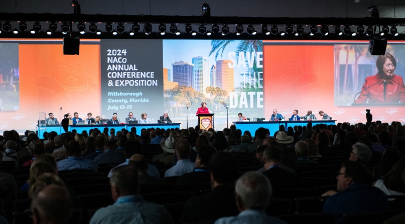 NACo President Mary Jo McGuire takes the podium at the 2023 Annual Conference in Travis County, Texas. Photo by Denny Henry