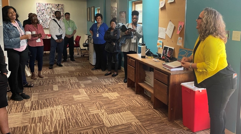 County Juvenile Justice Innovation Network Peer Exchange attendees tour the New Day Drop-In Center. (L-r): The Cumberland County, N.C. team Tiffany M. Whitfield, Nichelle Gaines, Kevin Brooks and Jason Hunter; Carmela Romero of Bernalillo County, N.M.; the Martin County, N.C. team: Emily Biggs, Tracie Smith; and Brooke Tafoya, executive director, New Day Youth & Family Services. Photo by Megan Siwek