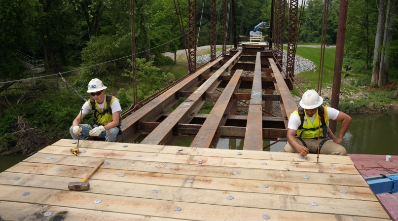 Workers reassemble restored pieces of the Old River Bridge May 14 in Saline County, Ark. Photo courtesy of Trevor Villines