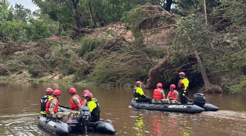Texas National Guard troops use boats to search for survivors in Kerr County following floods that began in the region on July 4, 2025. More than 230 Guard personnel are working in three counties to clear debris and conduct search and rescue operations. Photo courtesy of the Texas National Guard