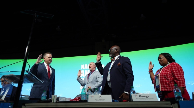 NACo President JD Clark swears in Immediate Past President James Gore, First Vice President George Dunlap and Second Vice President Alisha Bell. Photo by Denny Henry
