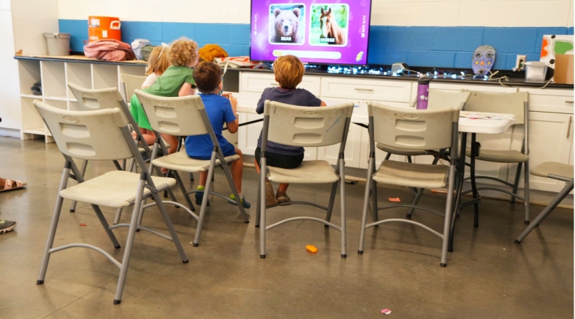 Children play an educational game in the library at the South Philadelphia Community Health and Literacy Center. Photo by Leon Lawrence III