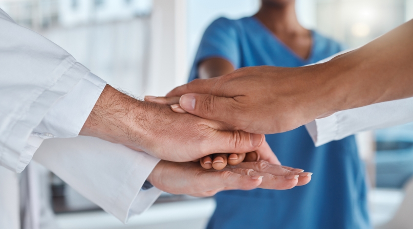 Medical motivation, doctor success and hands of team of hospital workers stacked for healthcare