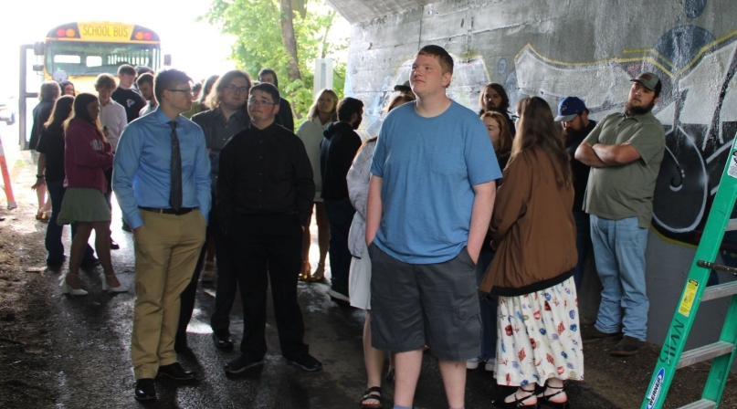 A Vermillion North High School senior admires the murals on in the tunnel close to campus. Photo by RJ Dunavan