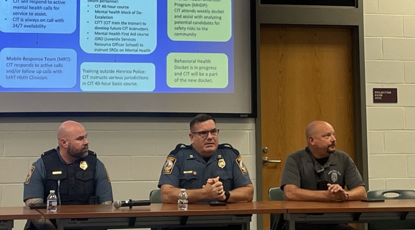 Officers from the Henrico County Police Division’s community services department discuss how they collaborate to help keep mentally ill people from continual jail visits. Photo by Meredith Moran 