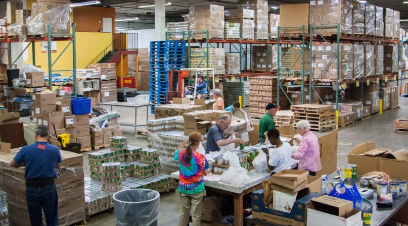 Workers sort meals at the Larimer County, Colo. Food Bank.