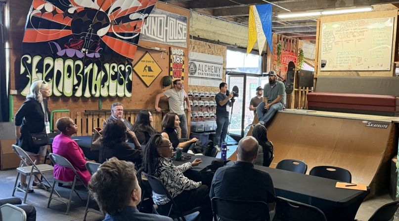 Taylor Woodruff, executive director of Youth Serving Agencies Network member organization Alchemy Skateboarding, outlines his organization's community-based programming for court-involved youth centered around skateboarding and manufacturing skills. Photo by Bryce Wilkom