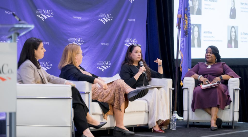 Tisamarie Sherry, Mary Kay Battaglia, Ann Olivia and Alisha Bell discuss housing initiatives. Photo by Front Room Studios