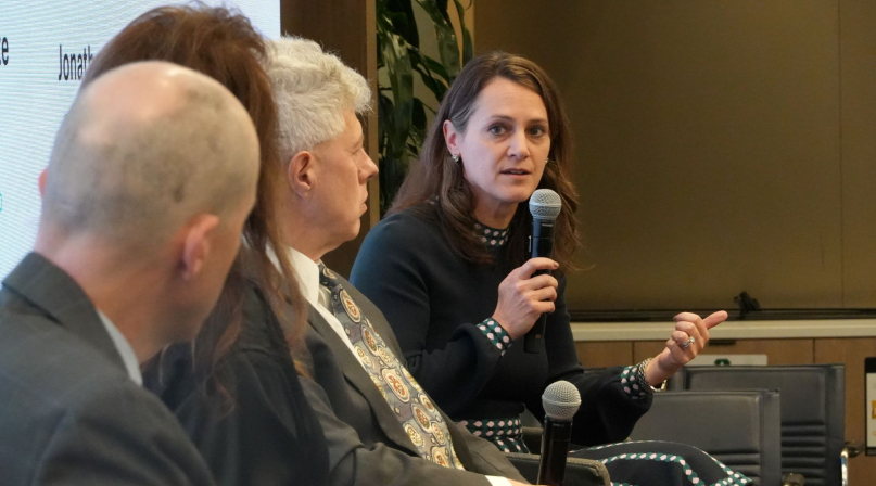 Ann Lichter, director of Resource Rural, tells county officials to offer feedback on federal programs during a RAC Fly-In panel discussion. Photo by Charlie Ban
