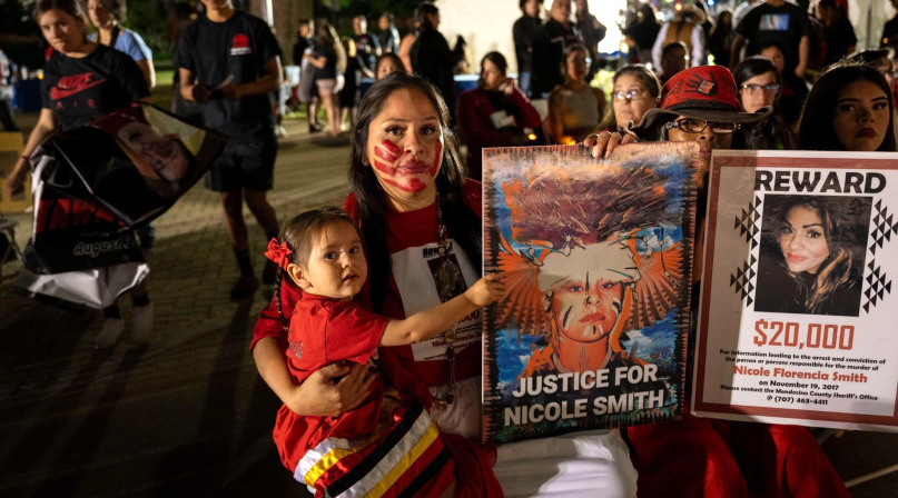 Bernadette Smith attends the vigil in honor of her sister Nicole, who was murdered in 2017. 