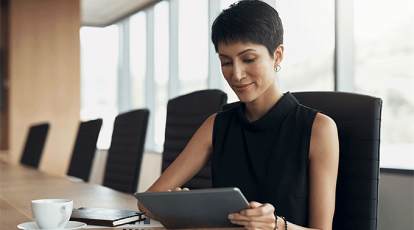 Woman reading on a laptop