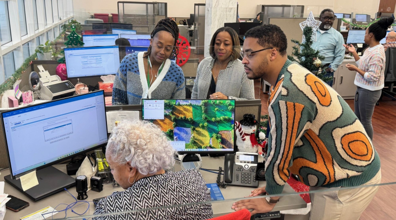 Staff members from different generations collaborate on a project in the Dallas County, Texas clerk's office. Photo courtesy of the Dallas County Clerk's Office