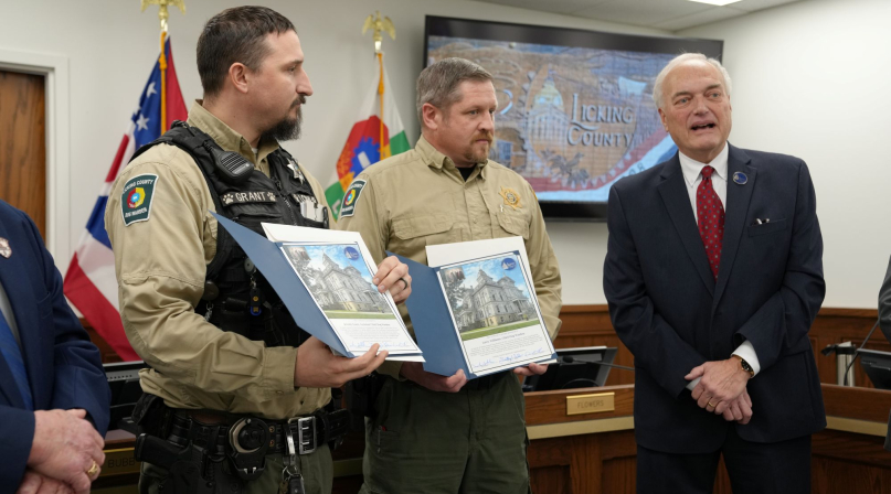 Licking County, Ohio Commissioner Tim Bubb (right) recognizes Licking County Dog Warden Larry Williams (center) and Assistant Chief Warden Jeremy Williams. Photo by Ryan Horns
