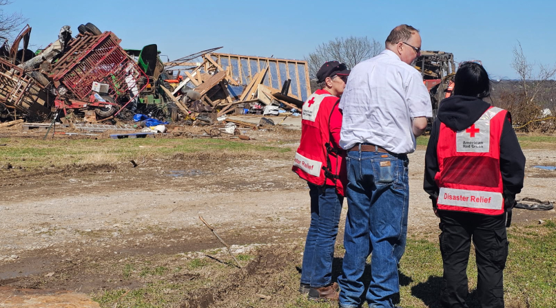 Okmulgee County, Okla. Emergency Manager Jeff Moore surveys tornado damage with Red Cross volunteers. Photo courtesy of the Red Cross