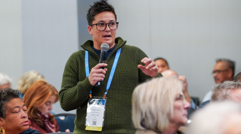 V. Fixmr-Oraiz, a Johnson County, Iowa county supervisor, asks a question during the workshop on H.R. 1. Photo by Leon Lawrence III