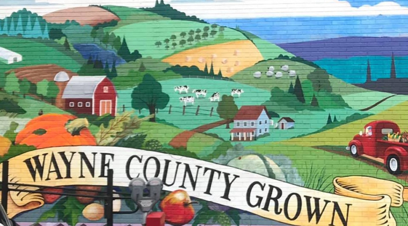 A mural on the wall of the Here and Now Brewing Company in Honesdale celebrates Wayne County, Pa.’s agricultural community.