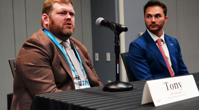 Tony Frye (left) discusses Federal Highway Administration priorities. Photo by Denny Henry