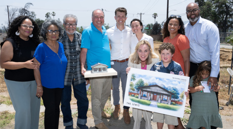 The Wood family, Supervisor Kathryn Barger and nonprofit representatives pose with a model and rendering of the Woods’ home design.  Photo by David Franco for Los Angeles County