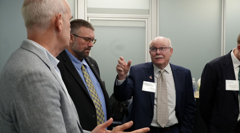 Converse County, Wyo. Commissioner Jim Willox (right) talks to Rep. Rick Larsen (D-Wash.) about the BUILD America 250 Act. Photo by Charlie Ban