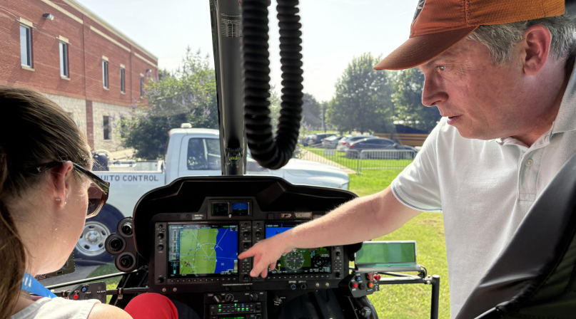 Aviation Supervisor Jeff Fletcher shows Wayne County, Mich. Commissioner Melissa Daub how the New Orleans Mosquito, Termite and Rodent Control Board's helicopter sprays for both mosquito adults and larvae.  Photo by Charlie Ban