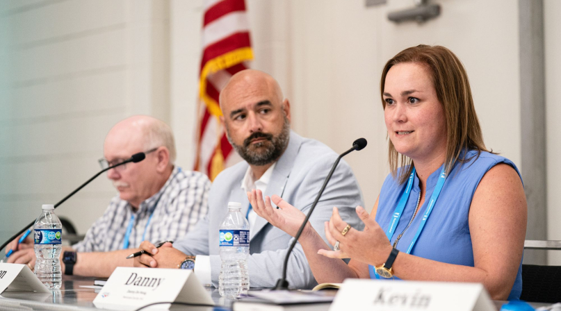 Danny DeHoog, deputy director of Government Relations, Maricopa County, Ariz., discusses state and federal policy impacts with fellow panelists Shawnee County, Kan. Commissioner Aaron Mays (to her immediate right) and Converse County, Wyo. Commissioner Jim Willox. Photo by Denny Henry