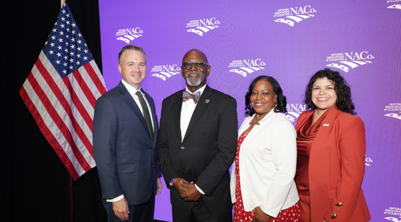 NACo's 2026-2027 officers gather following the 2026 Annual Business Meeting during the Annual Conference in Orleans Parish, La. From left: Immediate Past President J.D. Clark, President George Dunlap, First Vice President Alisha Bell and Second Vice President Sarah Benatar. Photo by Denny Henry
