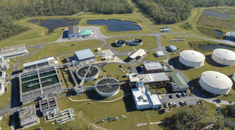 Modern water cleaning facility at urban wastewater treatment plant. Purification process of removing undesirable chemicals, suspended solids and gases from contaminated liquid - Stock Photo