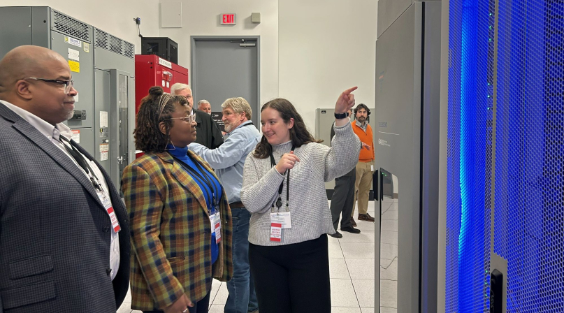 NACo Associate Legislative Director Emma Conover shows Wake County, N.C. Commissioner Shinica Thomas and her husband, Raymond, the inside of a server rack at a Digital Realty data center in Loudoun County, Va., in October 2025. Photo by Charlie Ban