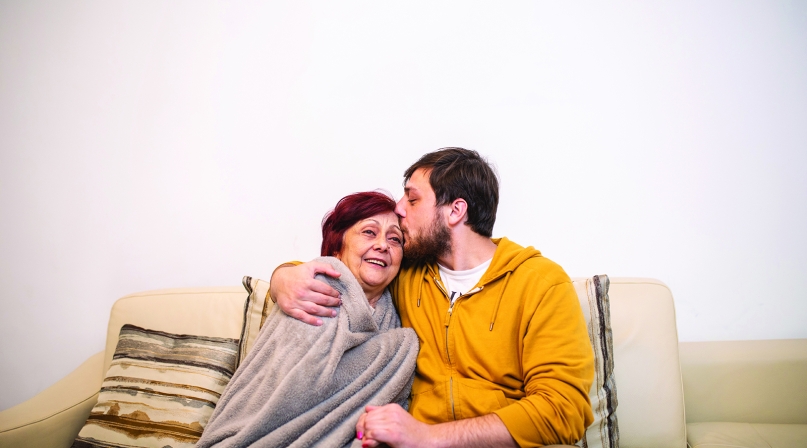 Image of GettyImages-1095974162_hug-on-couch_cmyk.jpg