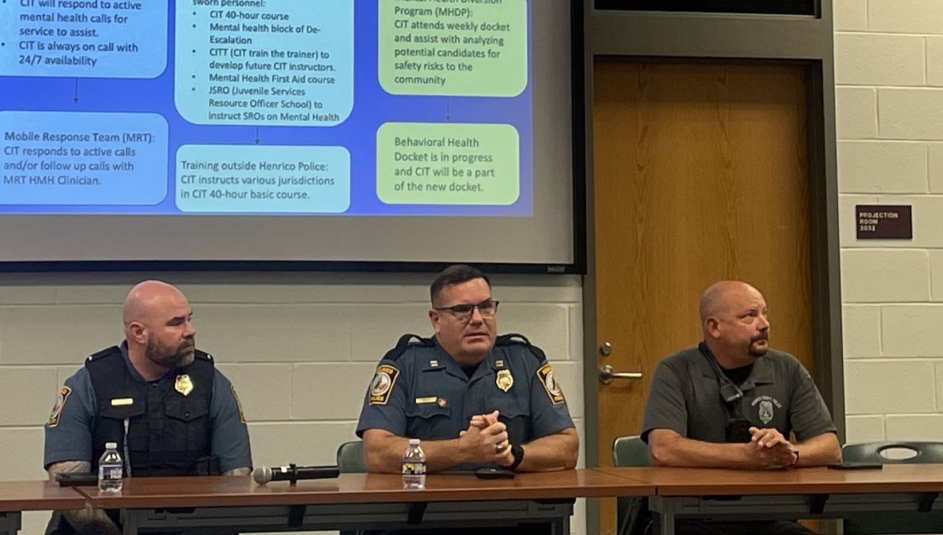 Officers from the Henrico County Police Division’s community services department discuss how they collaborate to help keep mentally ill people from continual jail visits. Photo by Meredith Moran
