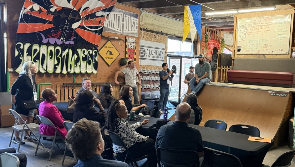 Taylor Woodruff, executive director of Youth Serving Agencies Network member organization Alchemy Skateboarding, outlines his organization's community-based programming for court-involved youth centered around skateboarding and manufacturing skills. Photo by Bryce Wilkom