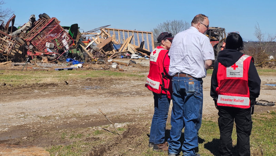 Okmulgee County, Okla. Emergency Manager Jeff Moore surveys tornado damage with Red Cross volunteers. Photo courtesy of the Red Cross