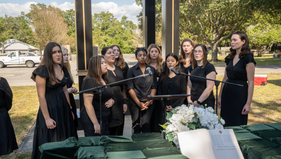 Choir members sing at a ceremony honoring the county's indigent who went unclaimed after their deaths.